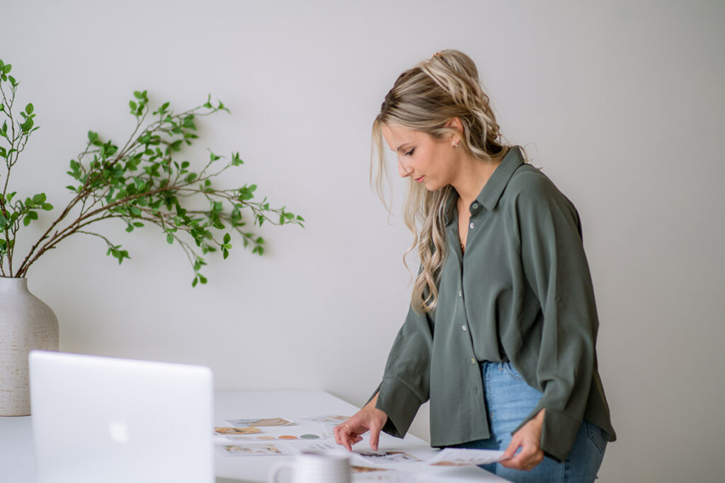 Small business owner planning a brand identity and reviewing common branding mistakes new businesses make.