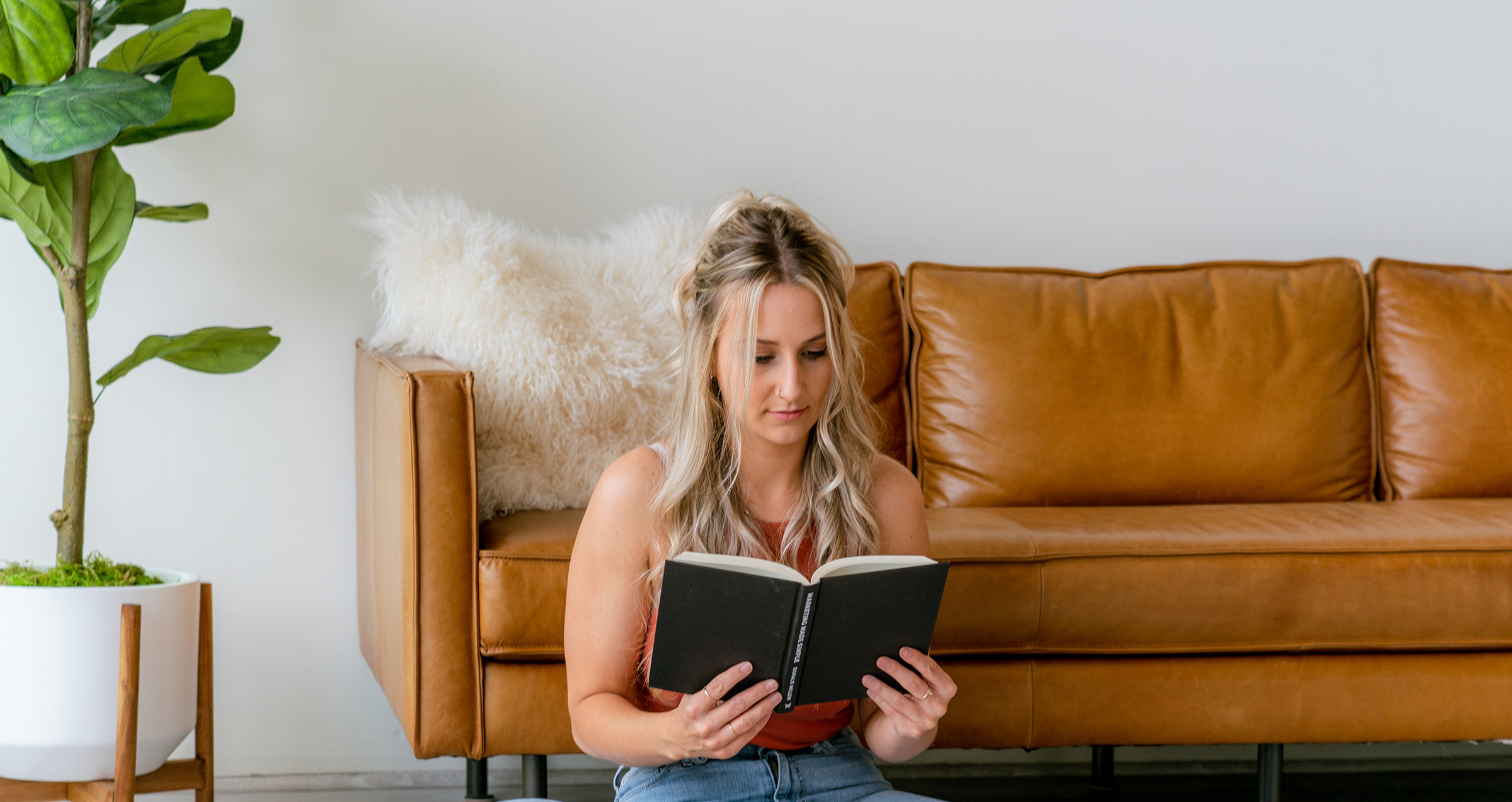 Business owner reading about common branding mistakes new businesses make