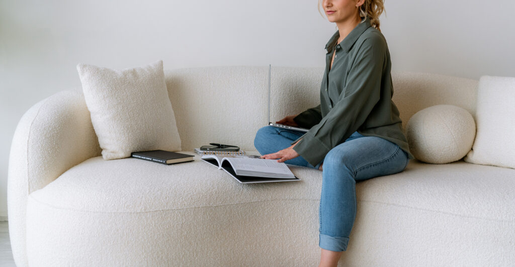 How to write website copy for services using a simple framework, shown by a service provider planning copy on a laptop