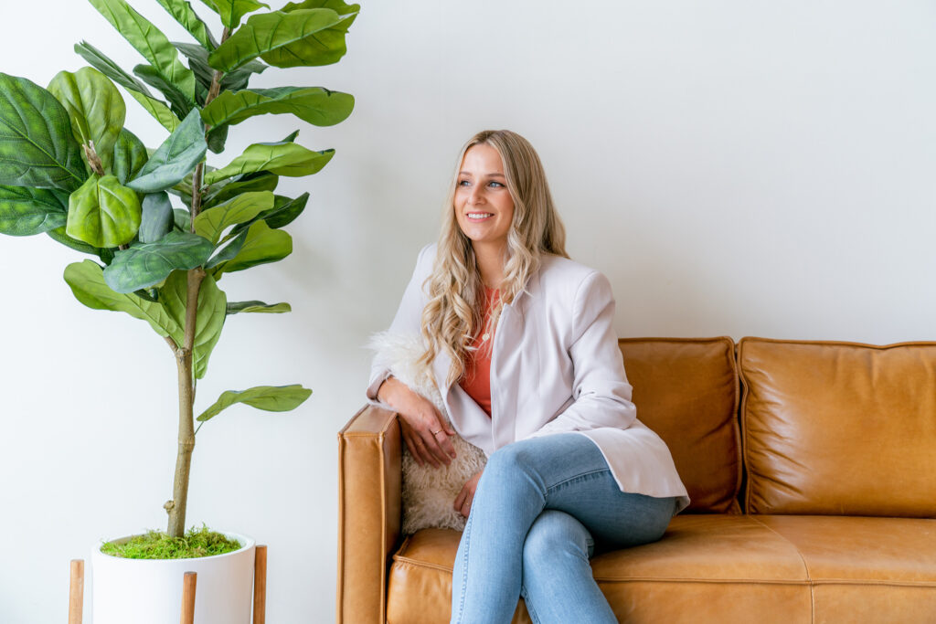 Proud business owner and WICMA finalist sitting on couch excited about nomination