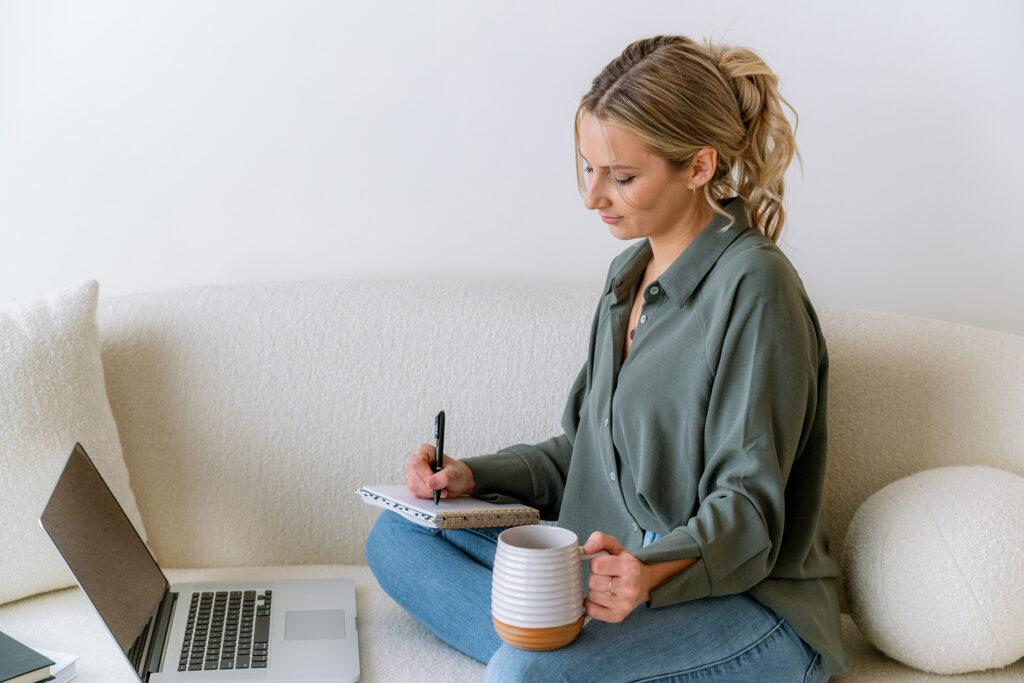 WICMA Finalist sitting and feeling accomplished while working on business building
