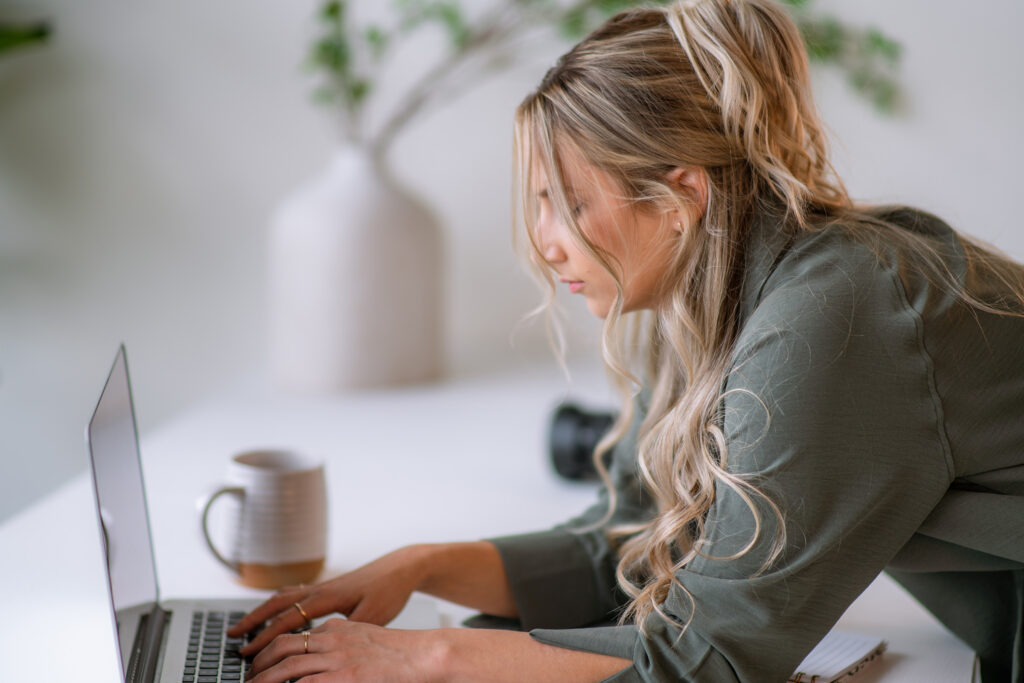 Writing homepage headlines using a brand messaging framework on a laptop