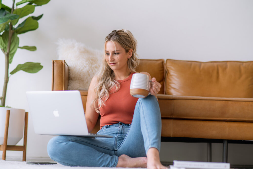 Creating a brand messaging framework while working on a laptop with coffee